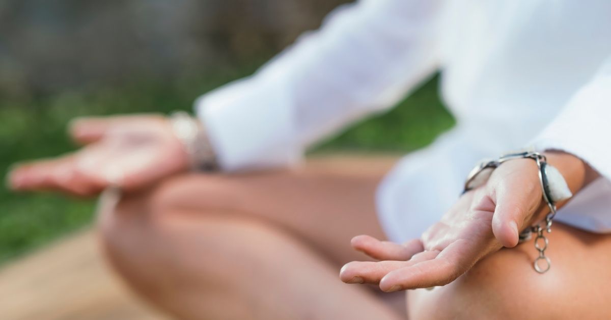 Person practicing somatic therapy meditation and mindfulness.